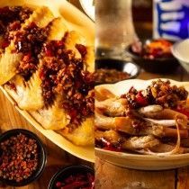 A close up of a plate of food on a wooden table.