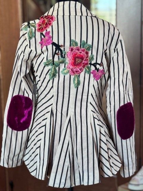 A striped jacket with flowers embroidered on the back
