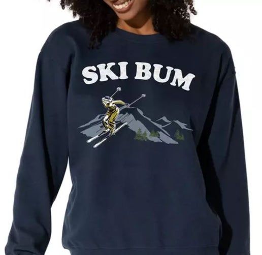 A woman is wearing a ski bum sweatshirt