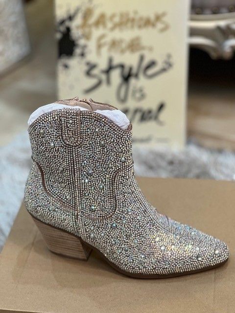 A pair of cowboy boots with rhinestones on them
