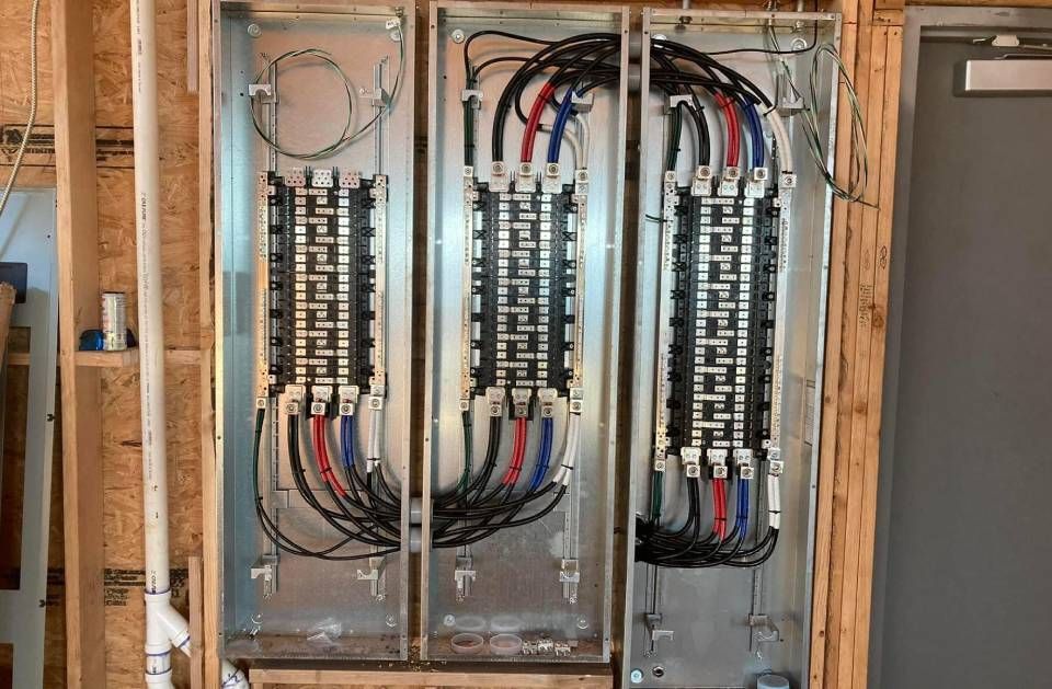 A large electrical box with a lot of wires coming out of it.