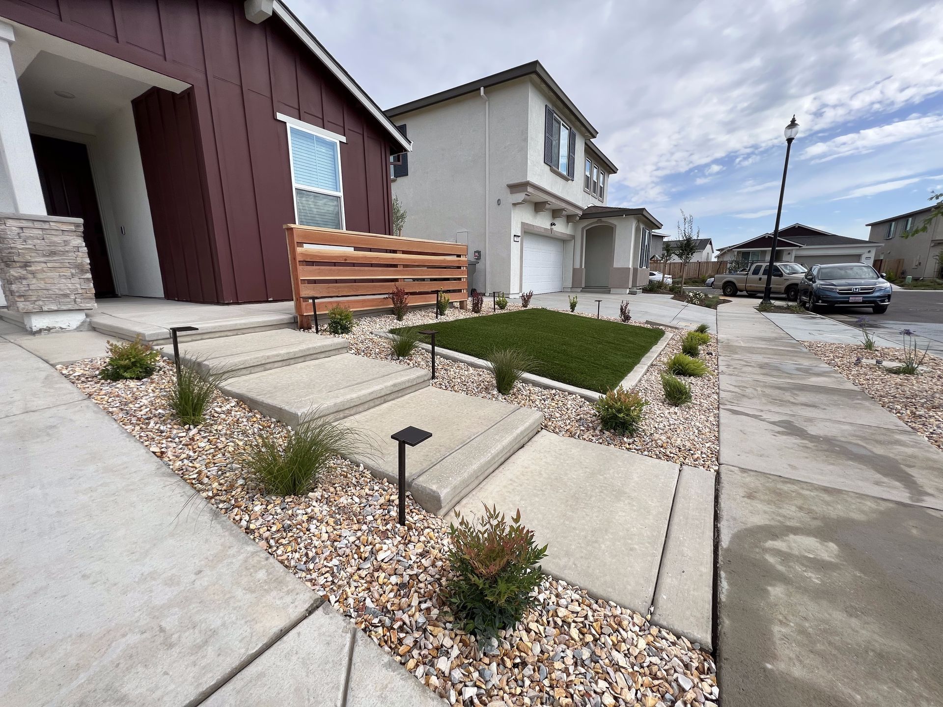 A house with a lawn and steps in front of it