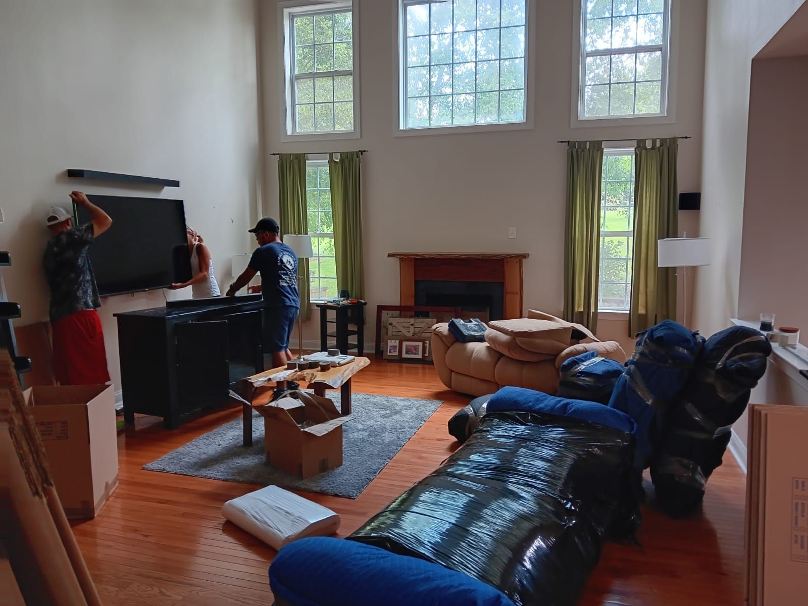 A living room filled with furniture and boxes.