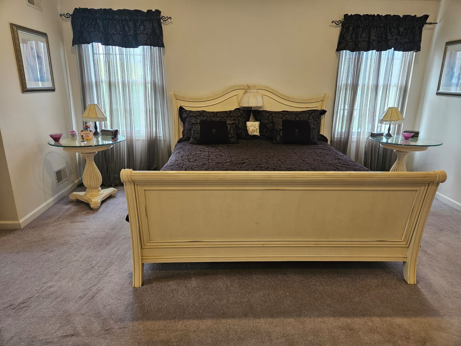A bedroom with a king size bed and two nightstands