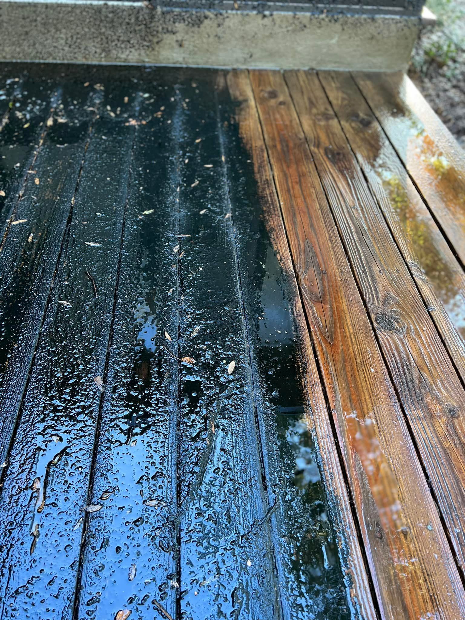 A wooden deck with a lot of dirt on it.