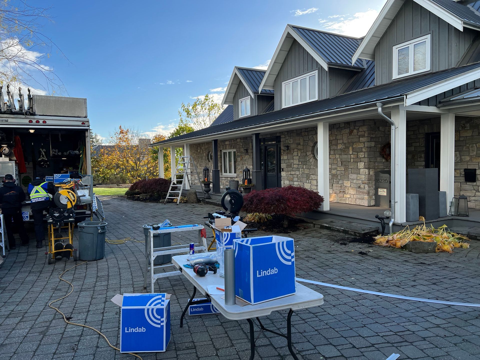 worker installing gutter pipeline