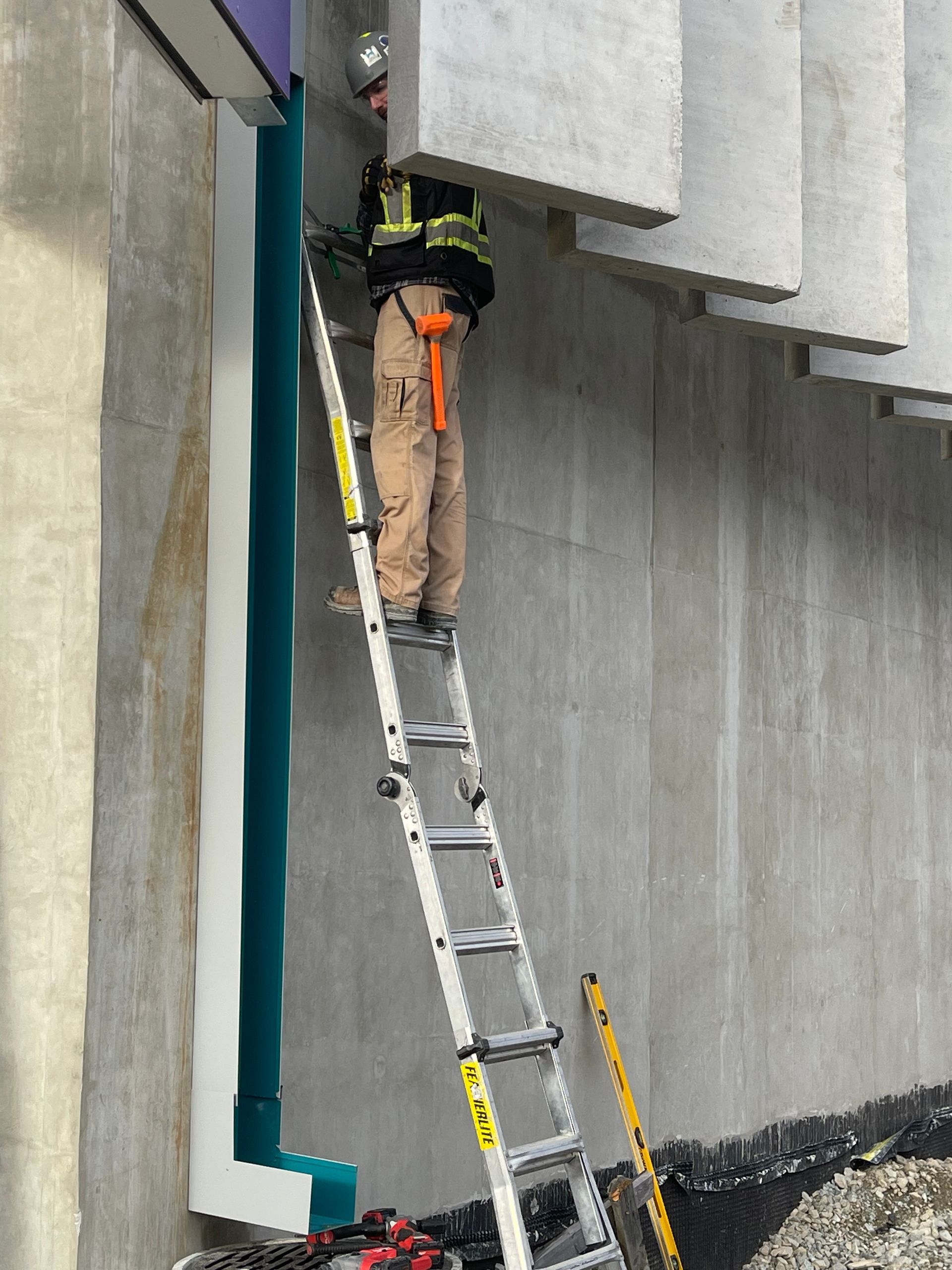 worker installing gutter pipeline