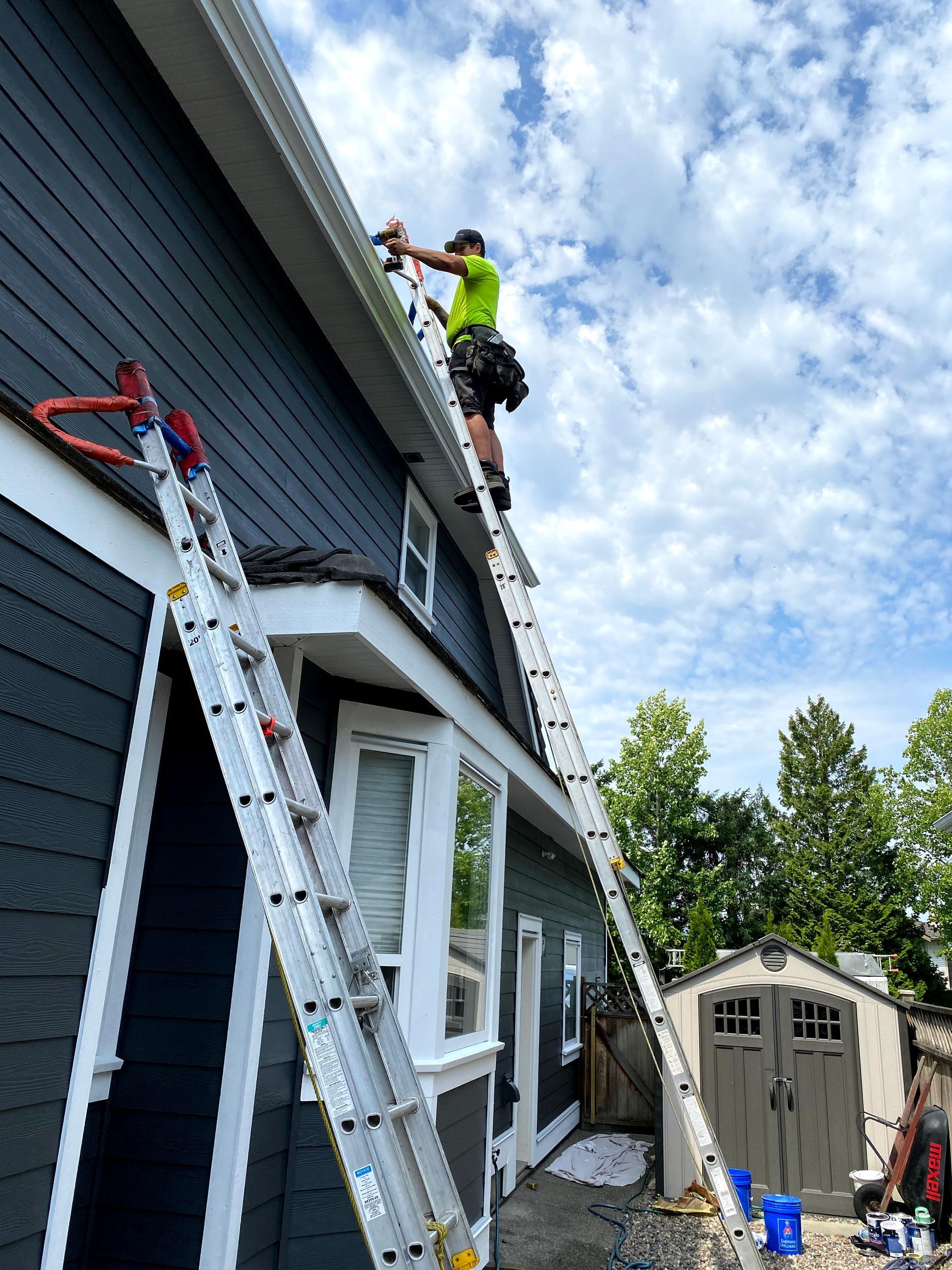worker installing gutter pipeline