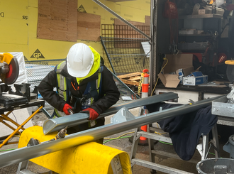 worker working on gutter pipeline