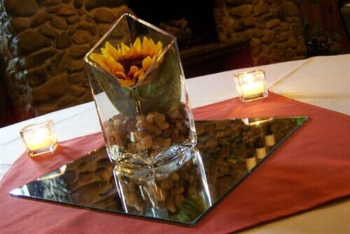 Yellow flower in an elegant clear vase — Fort Wayne, IN — Goeglein's Catering