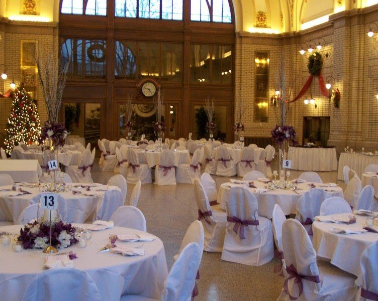 White coverings with purple ribbons — Fort Wayne, IN — Goeglein's Catering