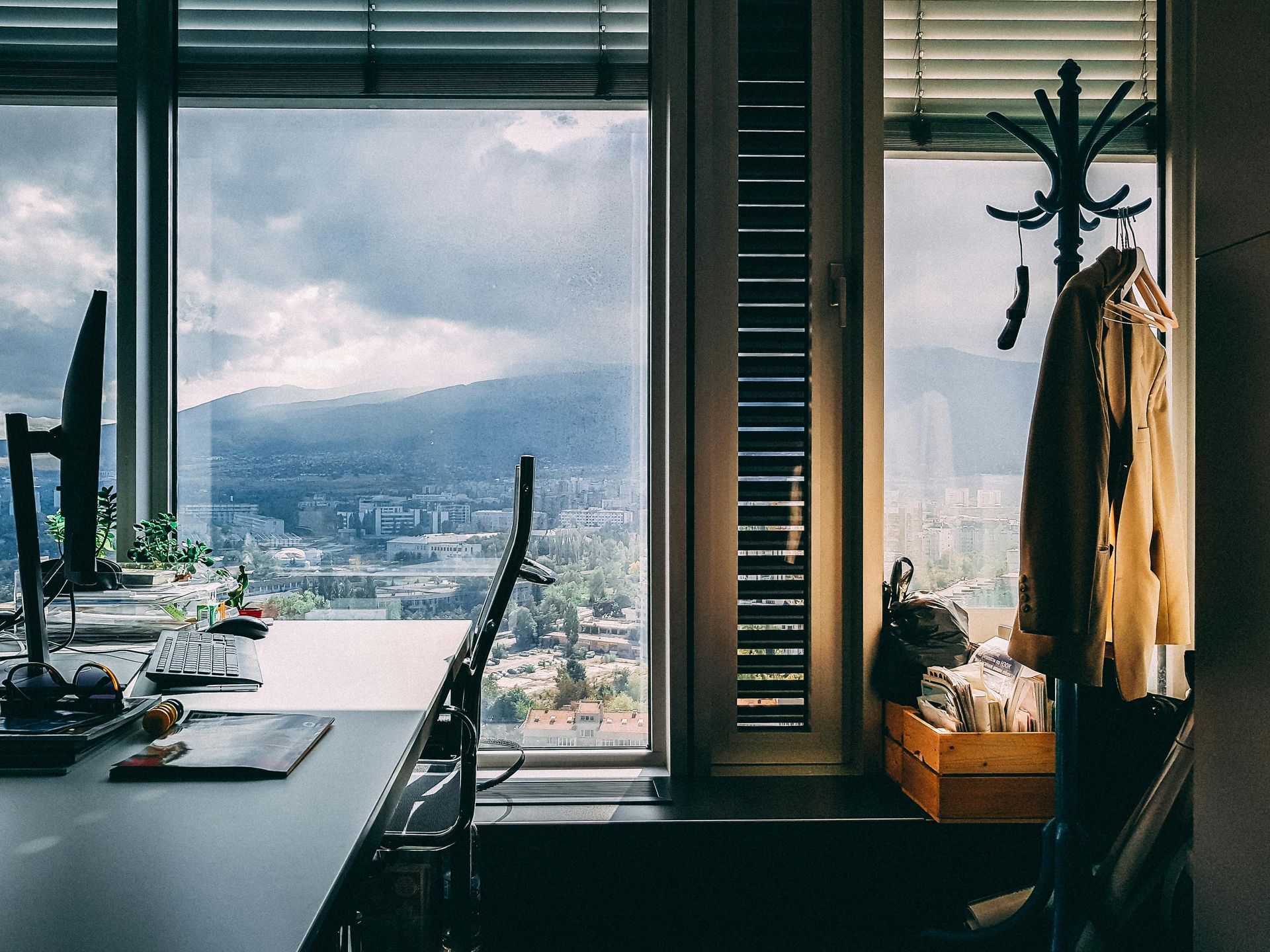 A room with a desk and a window with a view of a city at Hunt Digital Solutions