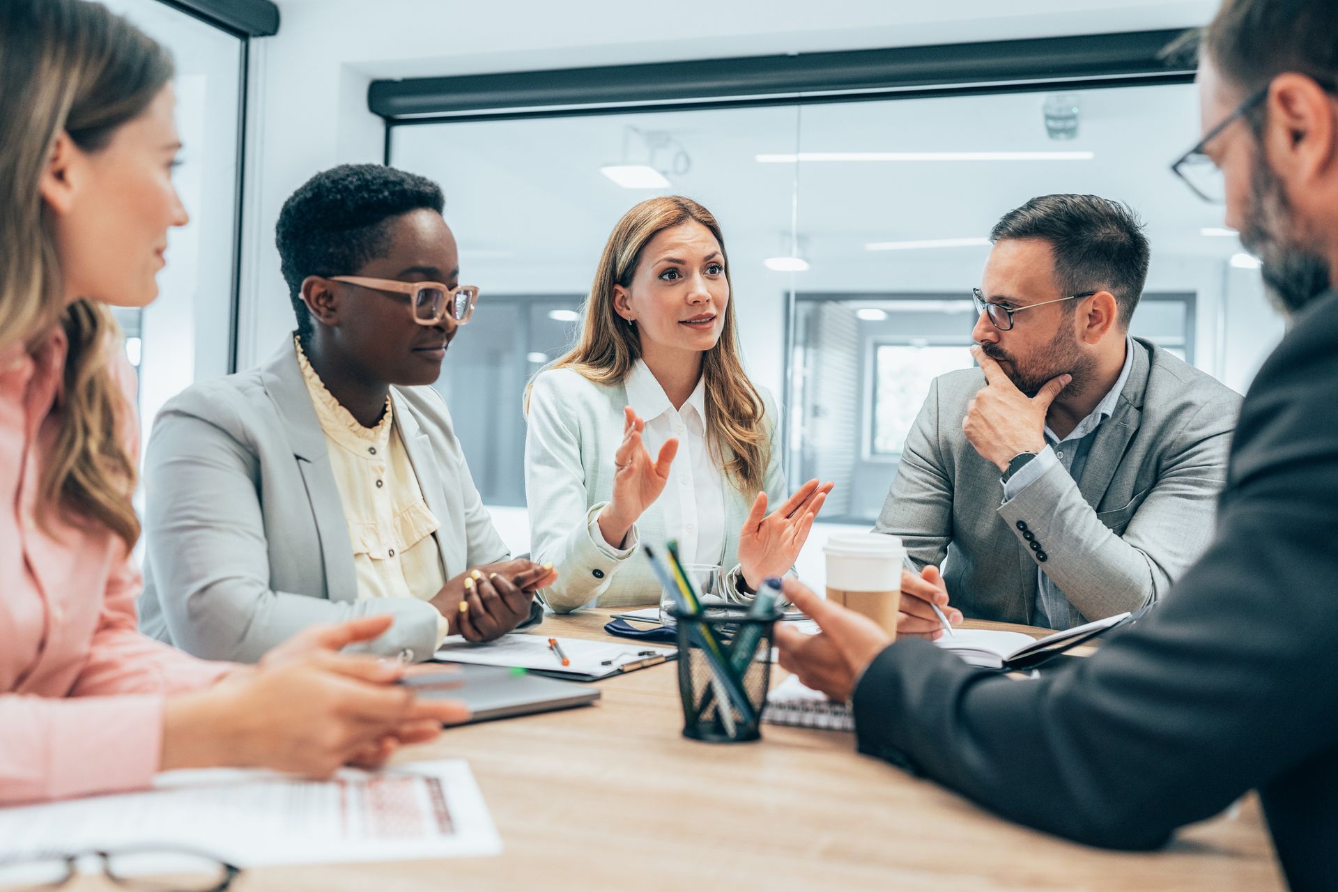 A group of people are having a meeting in an office.