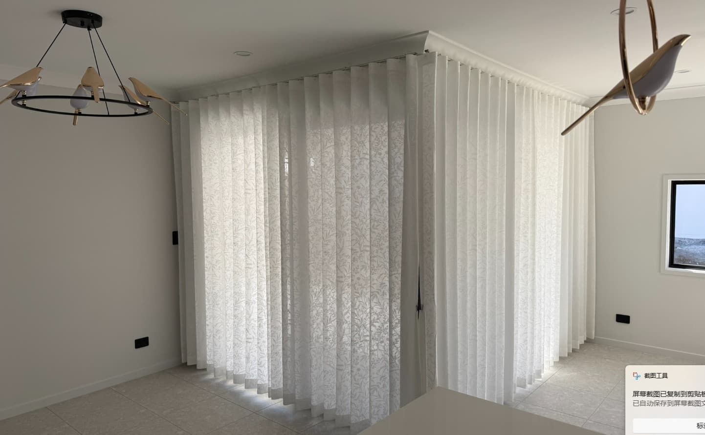 A Bright Airy Room with Sheer White Curtains Covering a Corner Window — U Curtains in Acacia Ridge, QLD