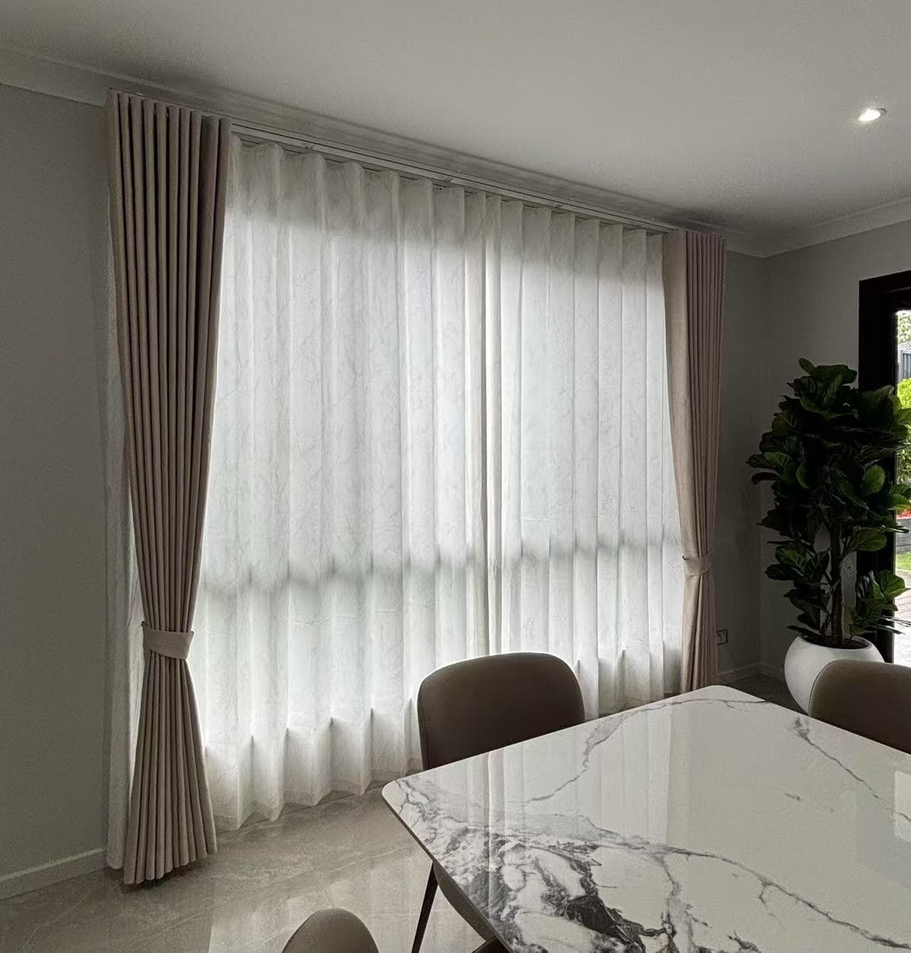 Dining Room with A Marble Table, Two Chairs and Neutral-Toned Curtains — U Curtains in Acacia Ridge, QLD