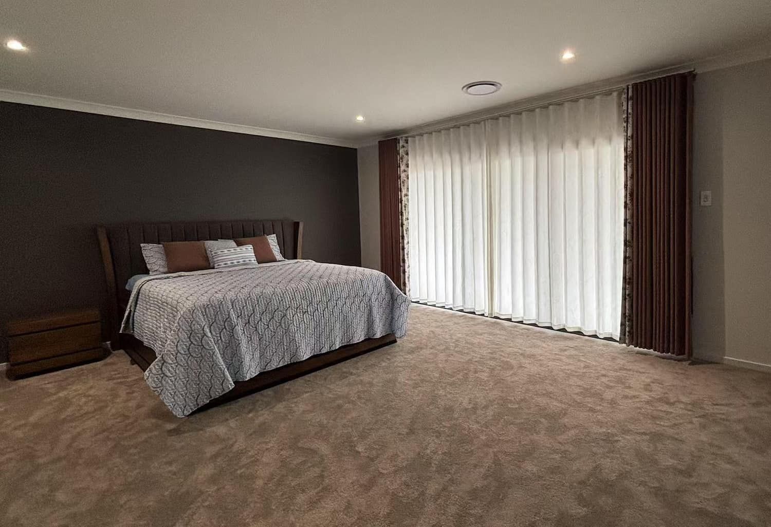 Bedroom with A Bed, Nightstand, Carpet, Curtains and Dark Accent Wall — U Curtains in Acacia Ridge, QLD