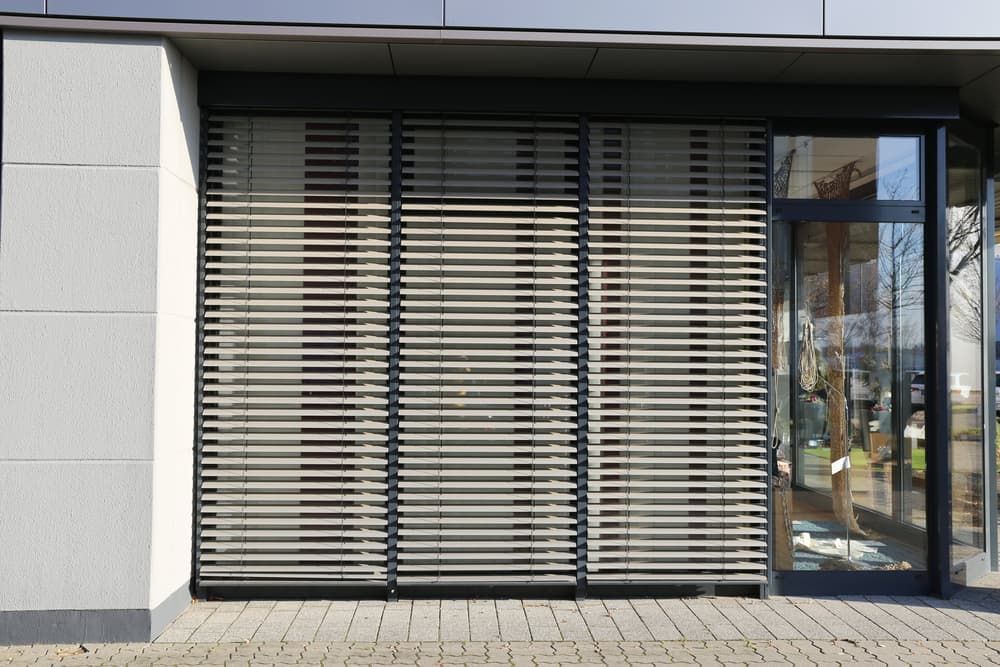 Exterior of A Building with Horizontal Wooden Blinds Covering a Large Window — U Curtains in Acacia Ridge, QLD