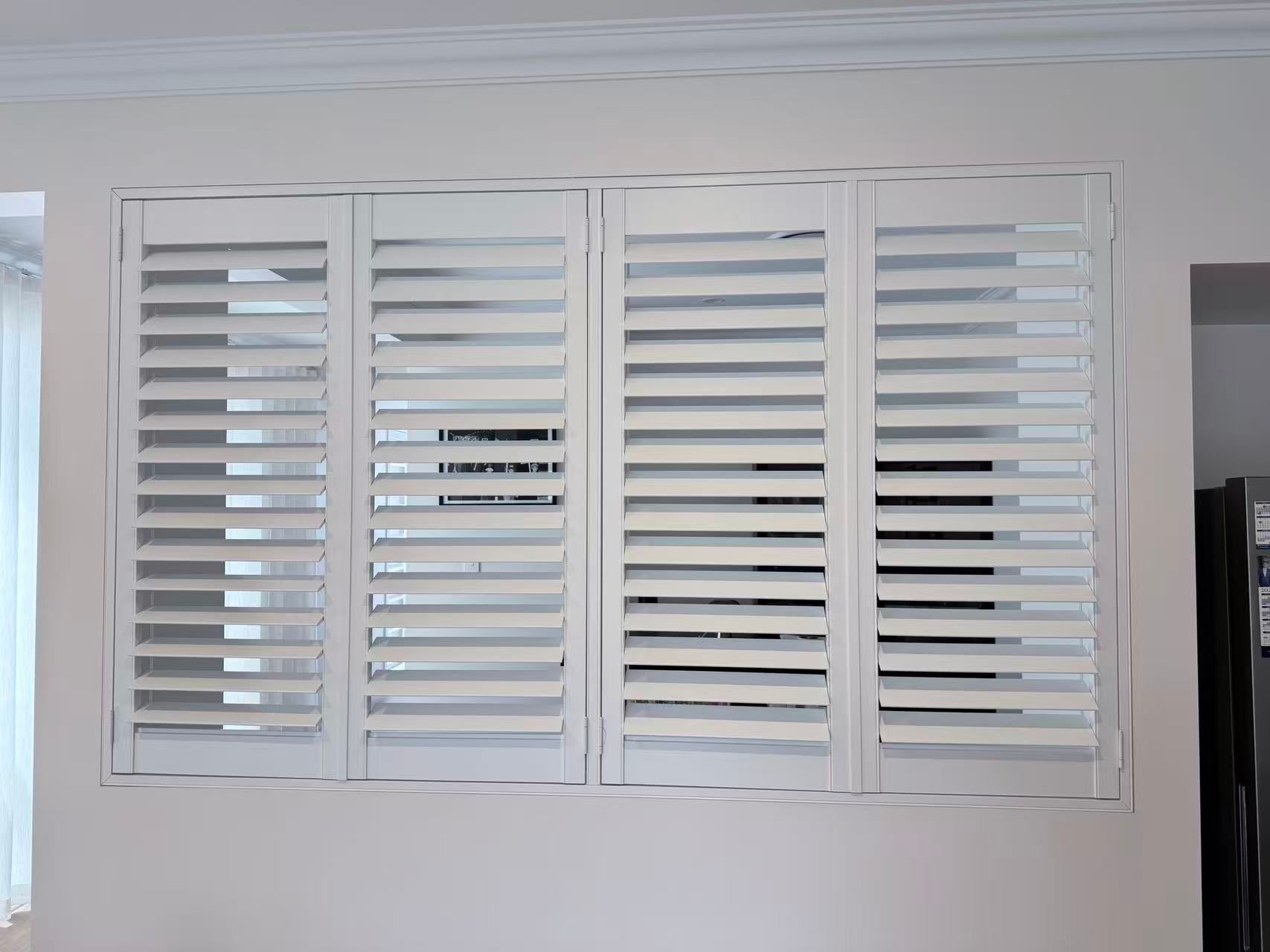 White Shutter-style Blinds Covering a Rectangular Window — U Curtains in Acacia Ridge, QLD