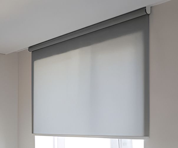 Gray Roller Blind Covering a Window Mounted on A Light Gray Wall — U Curtains in Acacia Ridge, QLD