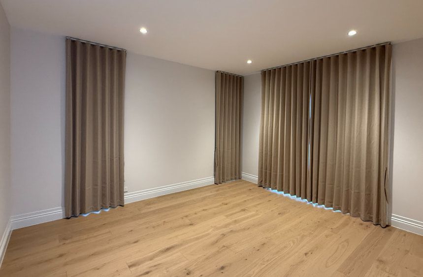 Empty Room with Light Wooden Floor, Beige Curtains and Recessed Ceiling Lights — U Curtains in Acacia Ridge, QLD