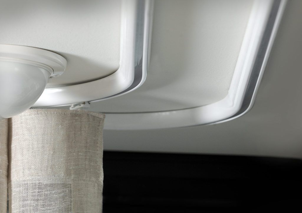 White Curved Track and Curtain Rod Attached to A White Ceiling with A Beige Curtain — U Curtains in Acacia Ridge, QLD