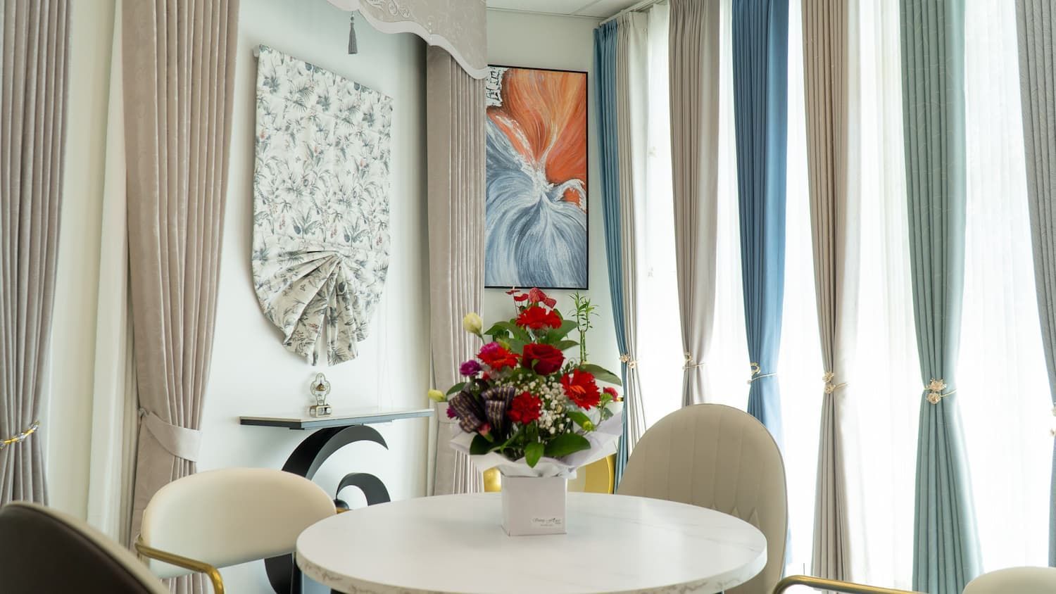 Dining Room with A White Table, Chairs and Flower Arrangement — U Curtains in Acacia Ridge, QLD