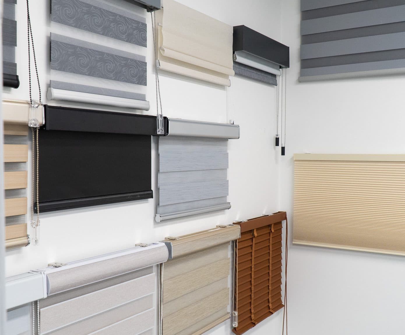 Various Window Blinds in Different Styles and Colors Displayed on A White Wall — U Curtains in Acacia Ridge, QLD