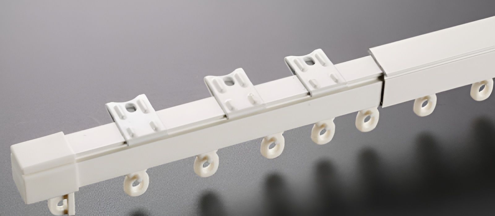 White Curtain Track with Wheels, Featuring Brackets for Mounting and A Connector — U Curtains in Acacia Ridge, QLD