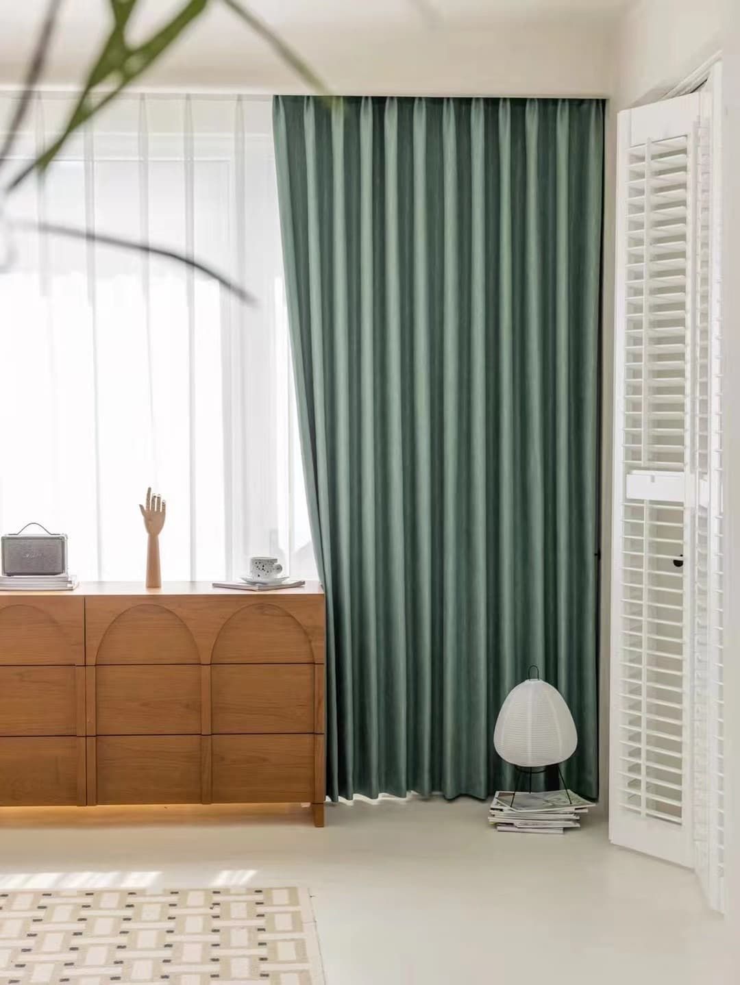 A Bright, Modern Room with Sage Green Curtains, Wooden Cabinet and White Shutters — U Curtains in Acacia Ridge, QLD