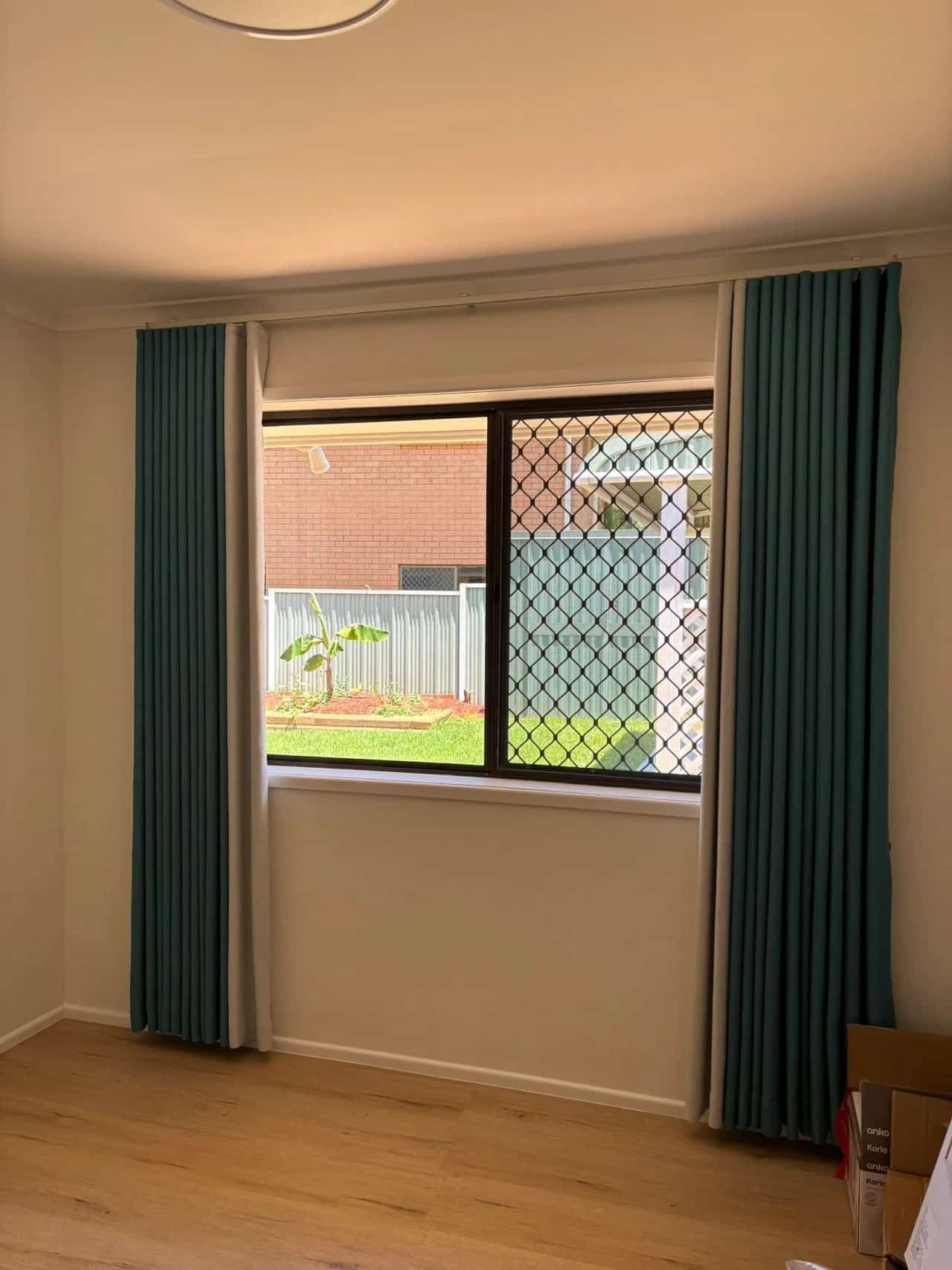 A Window with Turquoise Curtains on Either Side — U Curtains in Acacia Ridge, QLD