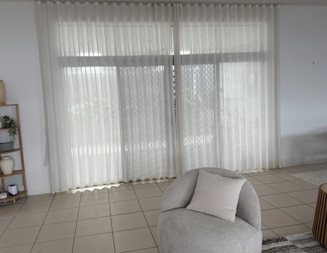 A Living Room with Sheer White Curtains Over a Window — U Curtains in Acacia Ridge, QLD