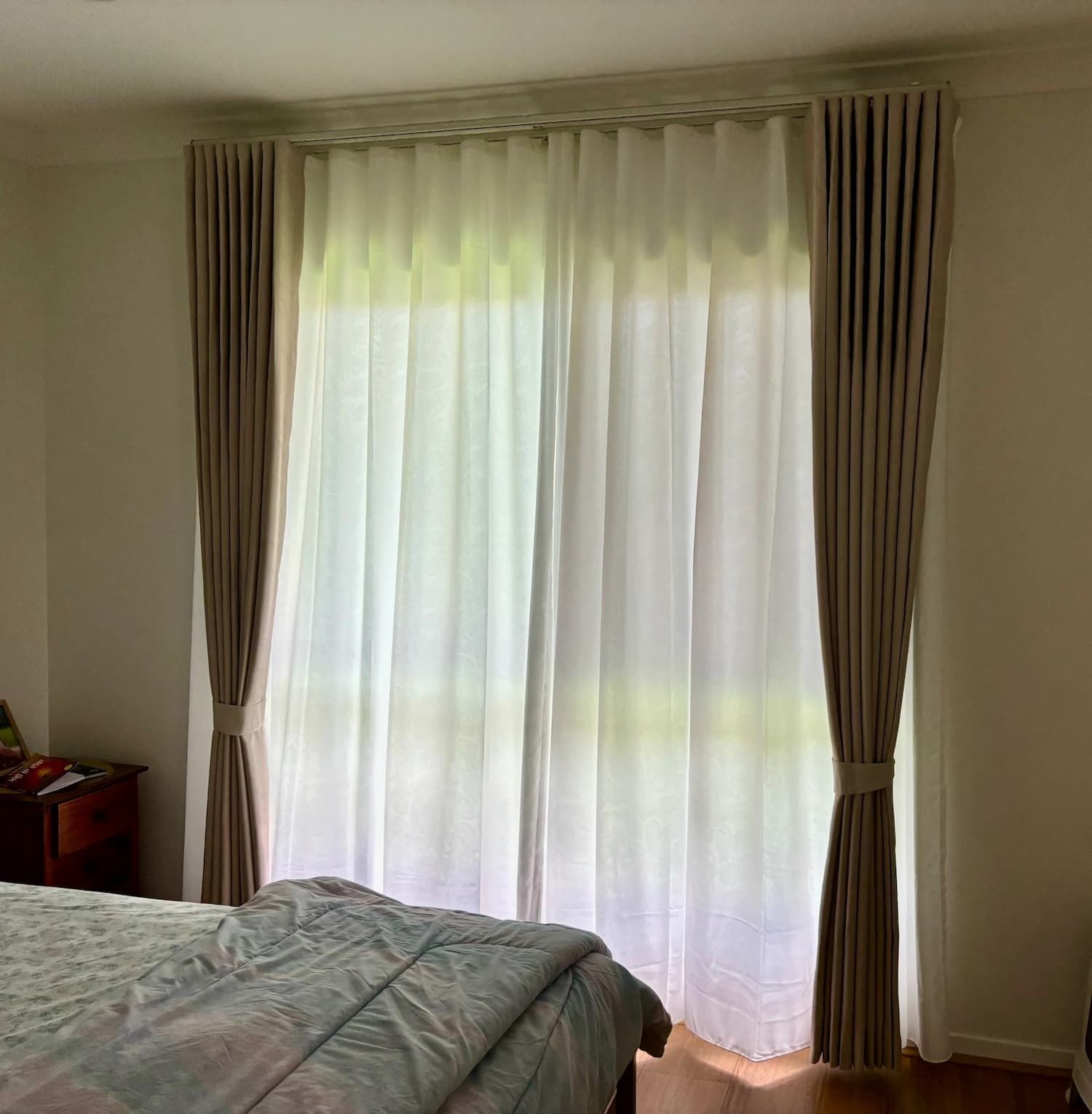 Bedroom Window with Sheer White Curtains and Beige Side Panels Tied Back — U Curtains in Acacia Ridge, QLD