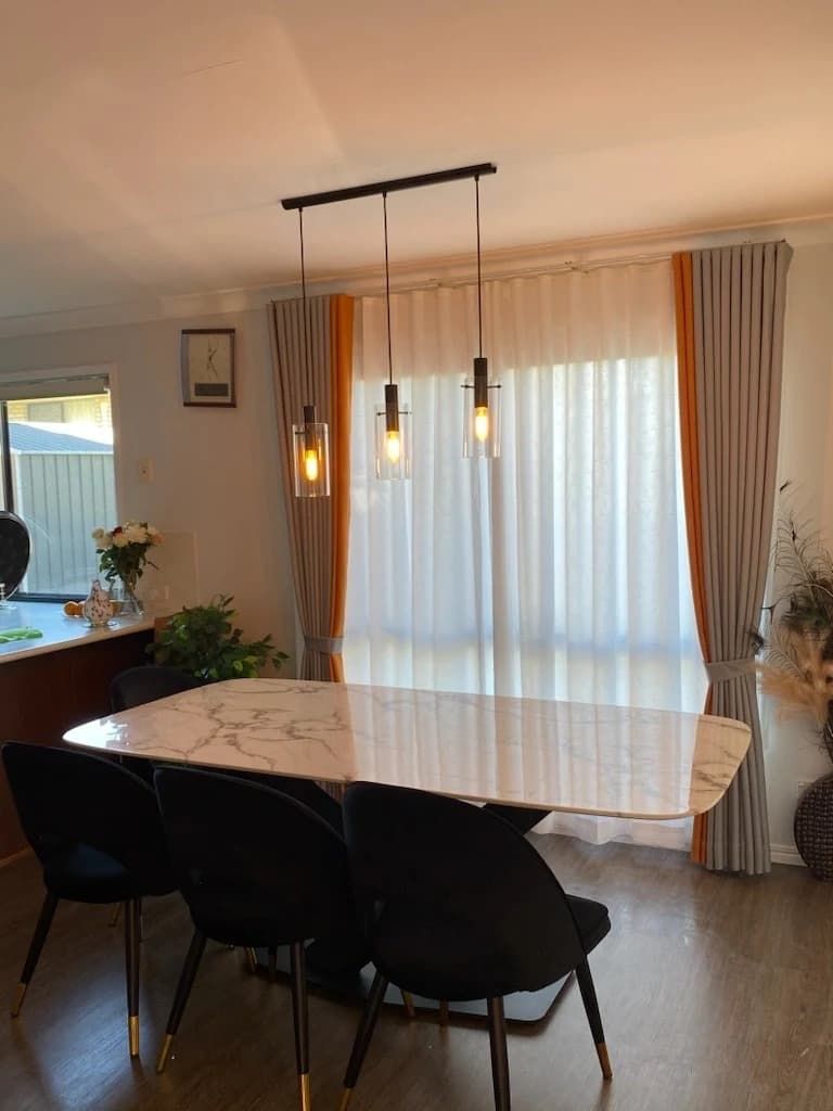 Dining Room with Marble-Topped Table, Black Chairs and Hanging Lights — U Curtains in Acacia Ridge, QLD