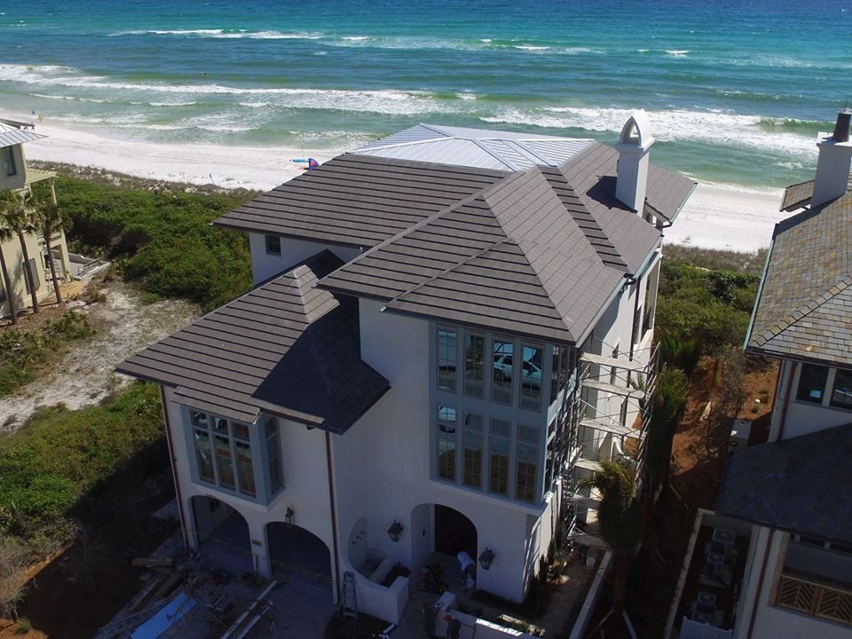 An aerial view of a house near the ocean