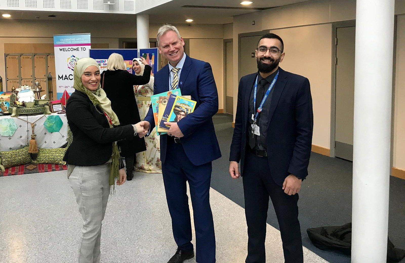 Dr. Sameena Haq (Left) presenting Books to Mr. Kevin Green, the Principal (Centre) and Mr. Imran Khan Aslam (Assistant Head of Department and Director of Standards).