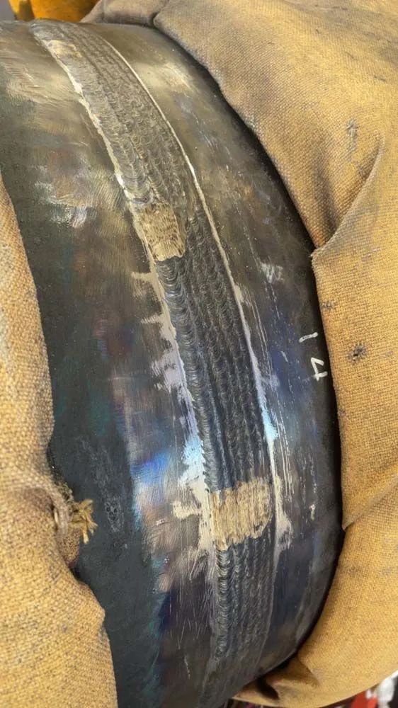 A close up of a tire with a hole in it