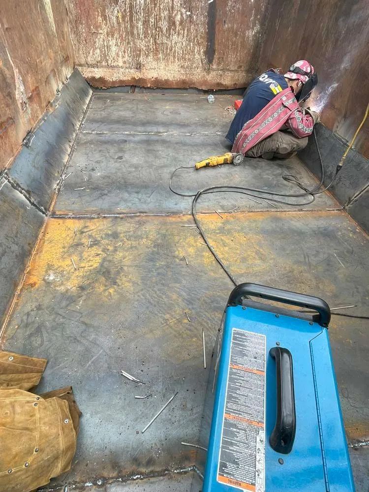 A close up of a welding process on a metal pipe