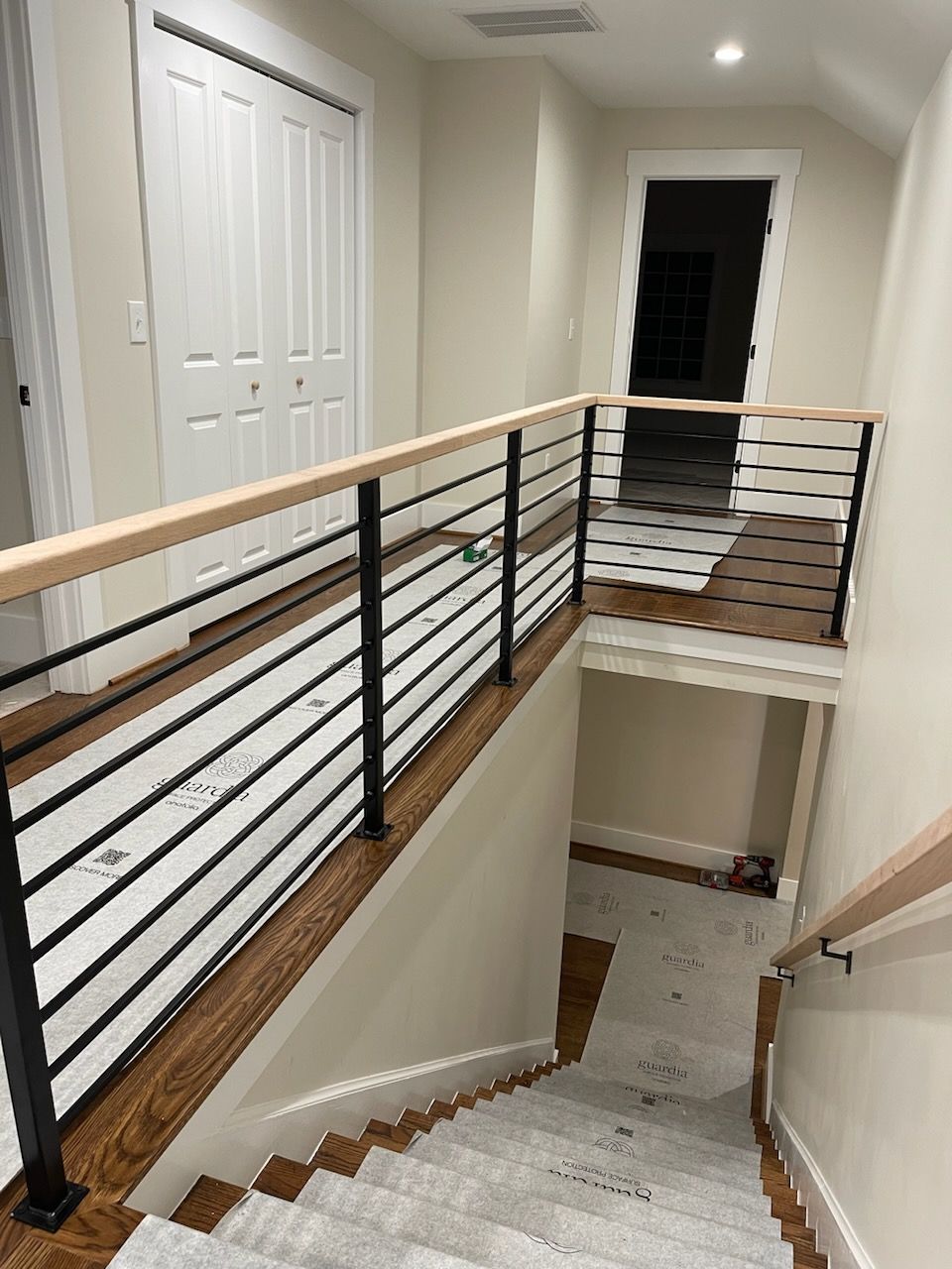 A ladder is attached to a concrete wall in a building