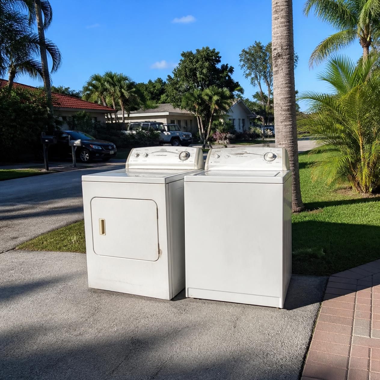 Washer and dryer on the curb of a home