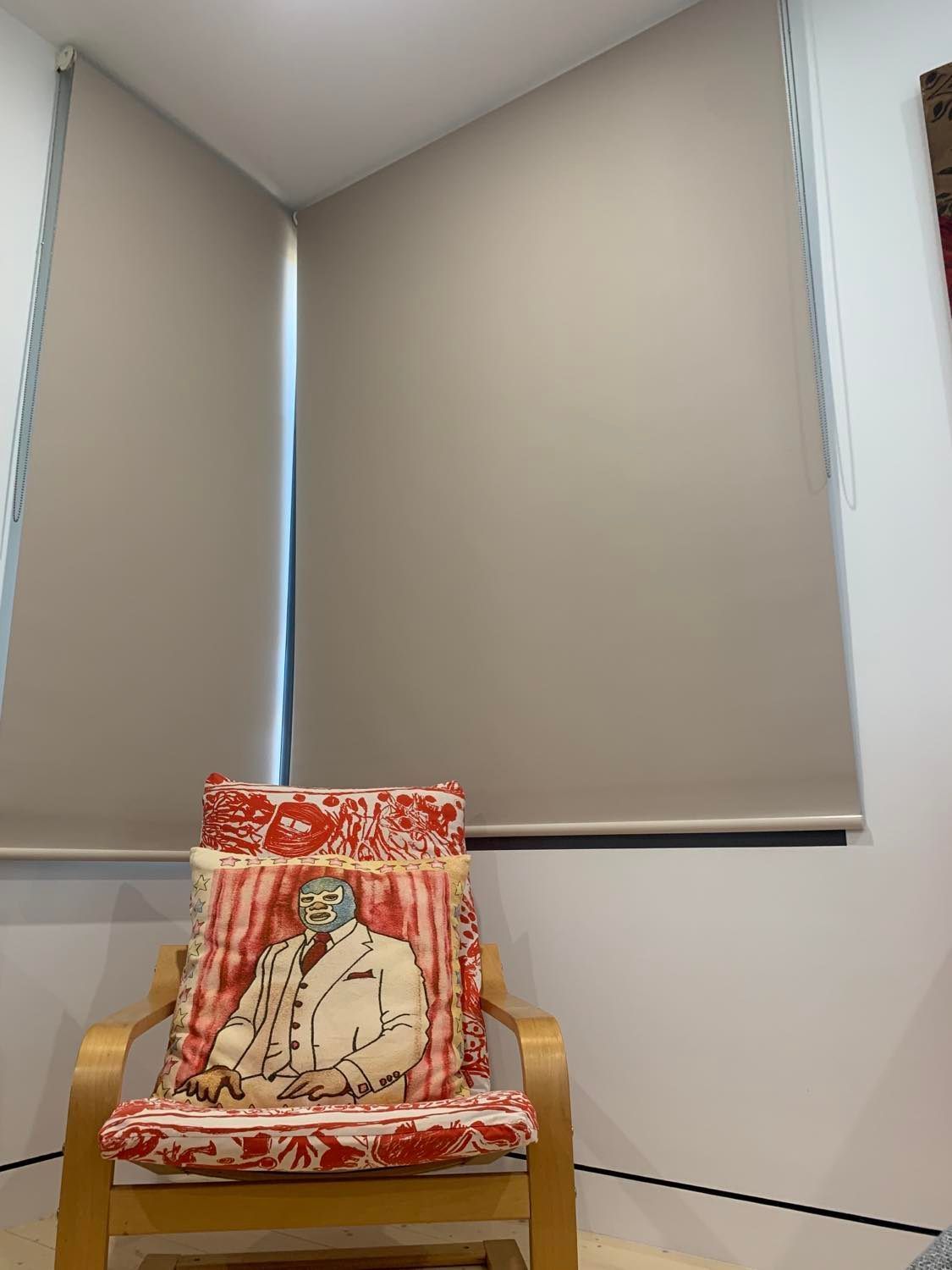 Chair with Red and White Cushion, Beneath Grey Roller Blinds — Alice Mobile Blinds in Ciccone, NT
