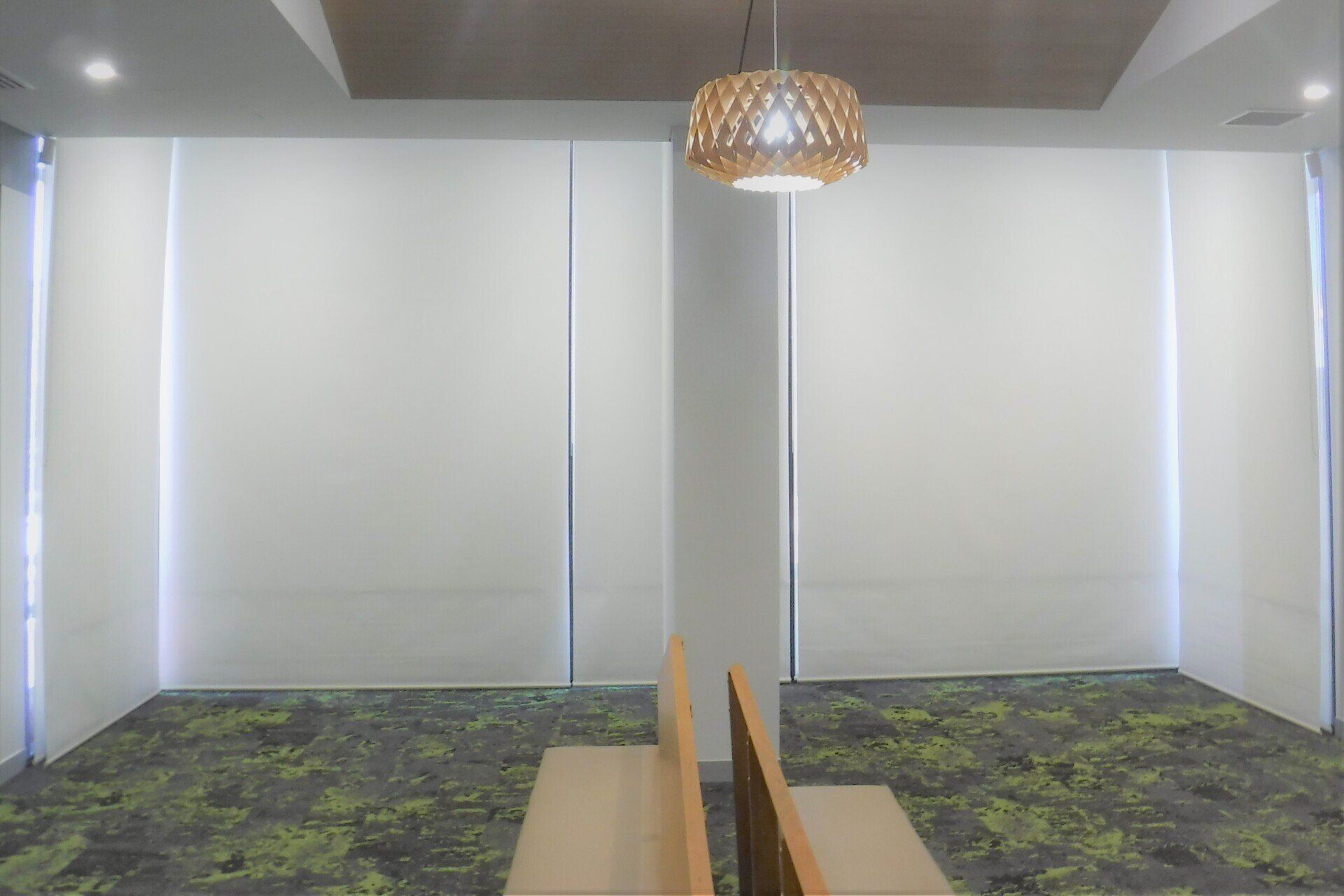 White Window Shades in A Room with A Patterned Carpet — Alice Mobile Blinds in Ciccone, NT