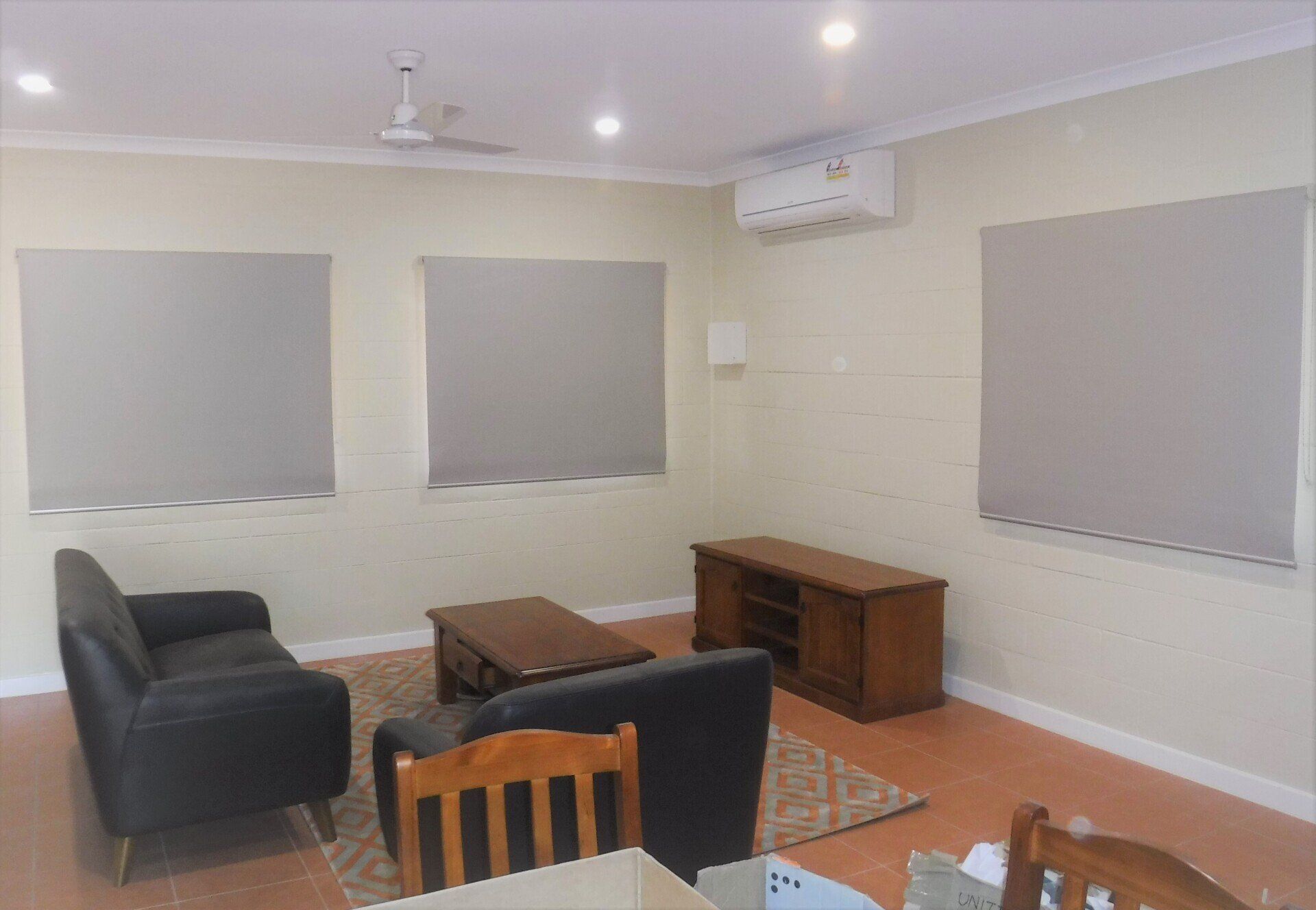 Living Room with Couches, Tv Stand, Windows with Blinds — Alice Mobile Blinds in Ciccone, NT