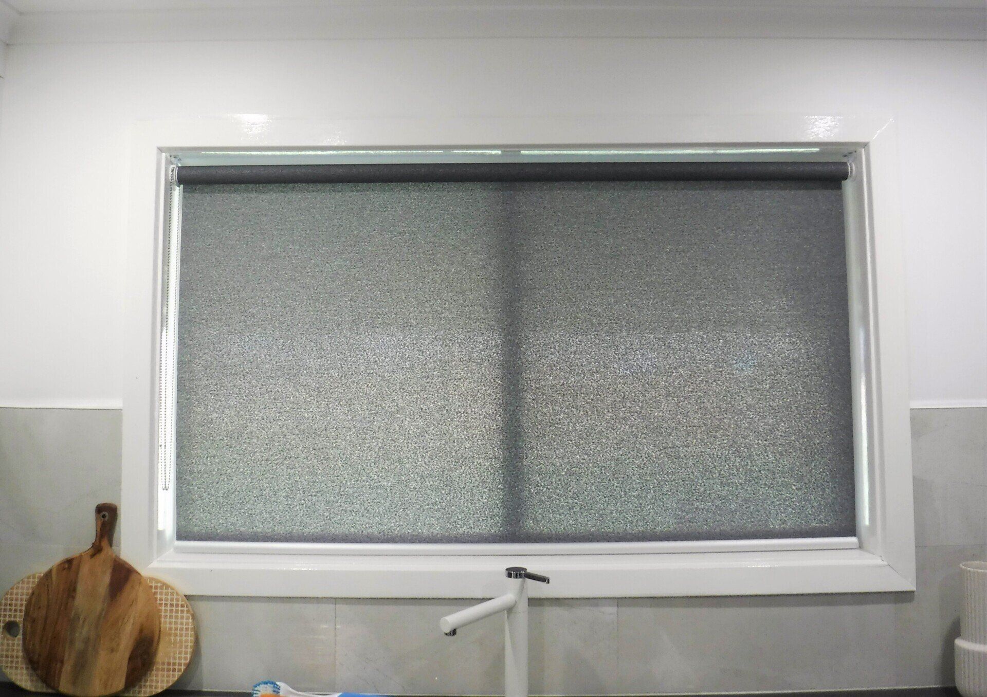 Window with A Dark Speckled Roller Blind — Alice Mobile Blinds in Ciccone, NT