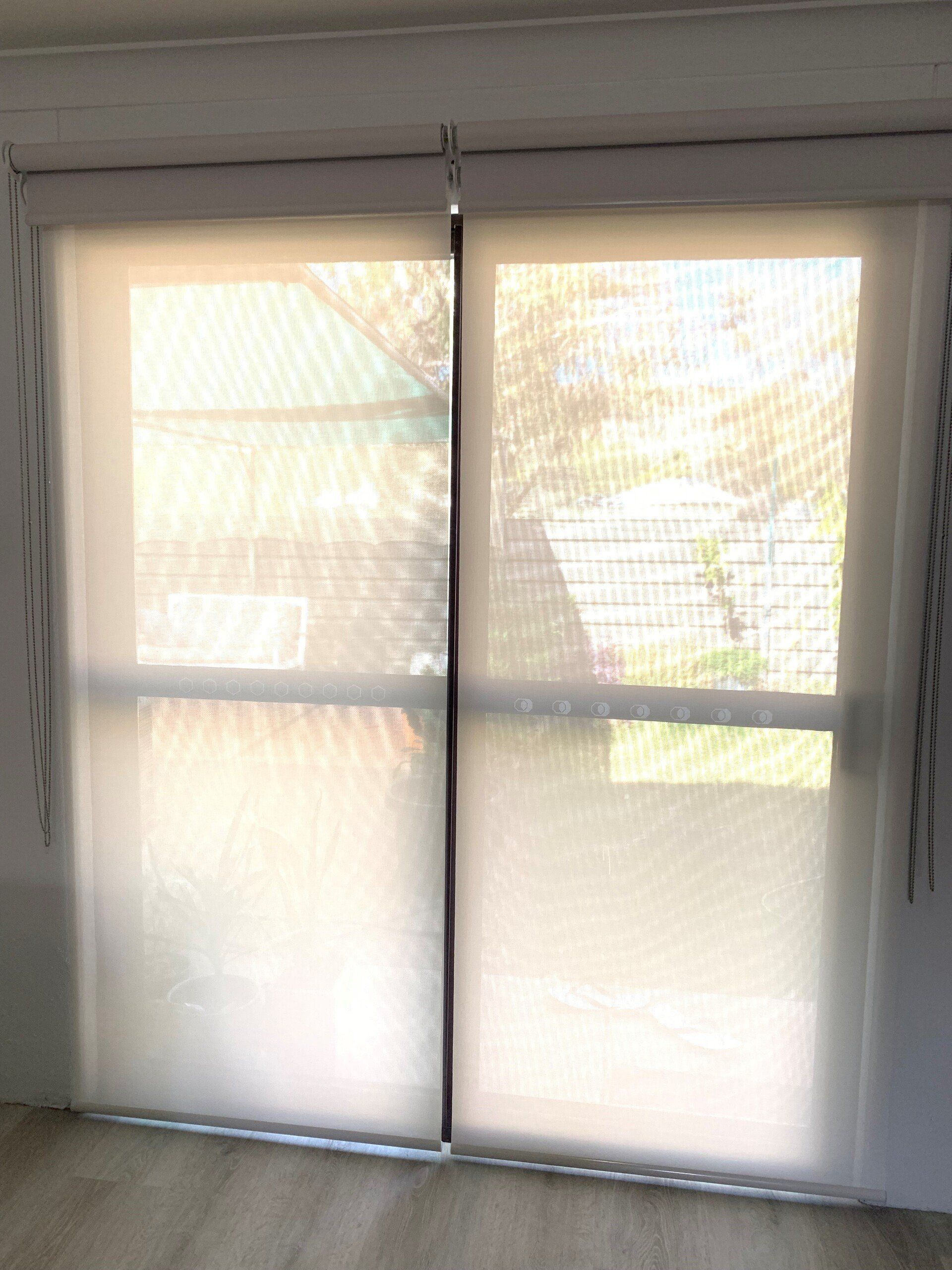 Two Closed, Light-Coloured Sheer Roller Blinds — Alice Mobile Blinds in Ciccone, NT