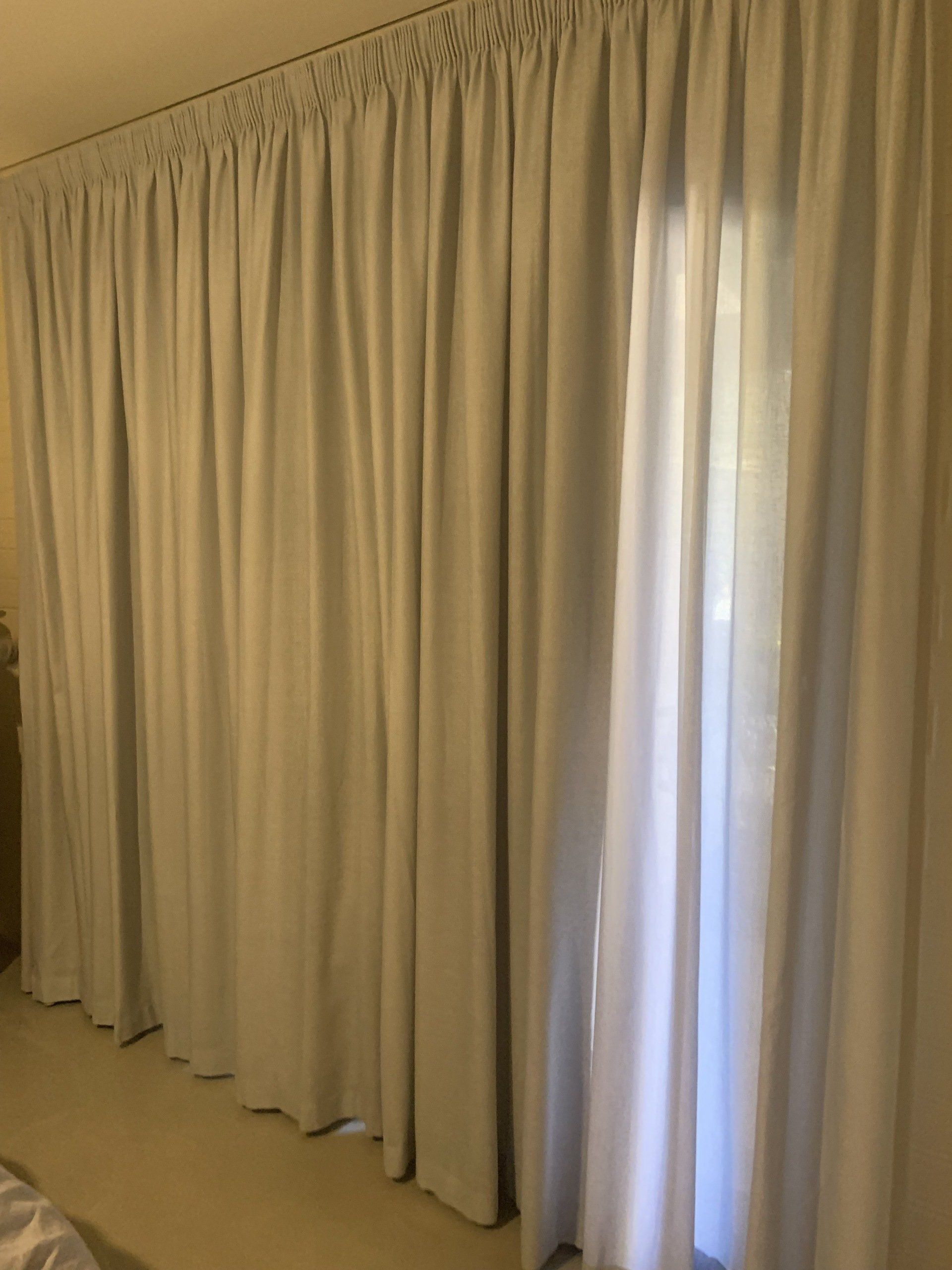 Light Grey Curtains Cover a Window — Alice Mobile Blinds in Ciccone, NT