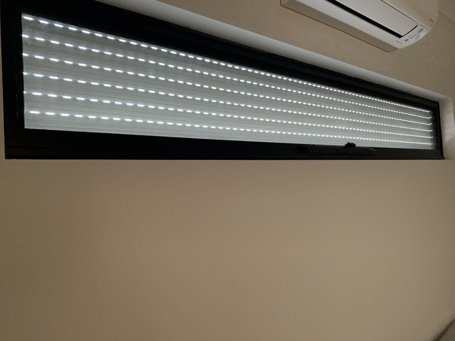 Long Rectangular Window with Closed Slatted Blinds — Alice Mobile Blinds in Ciccone, NT