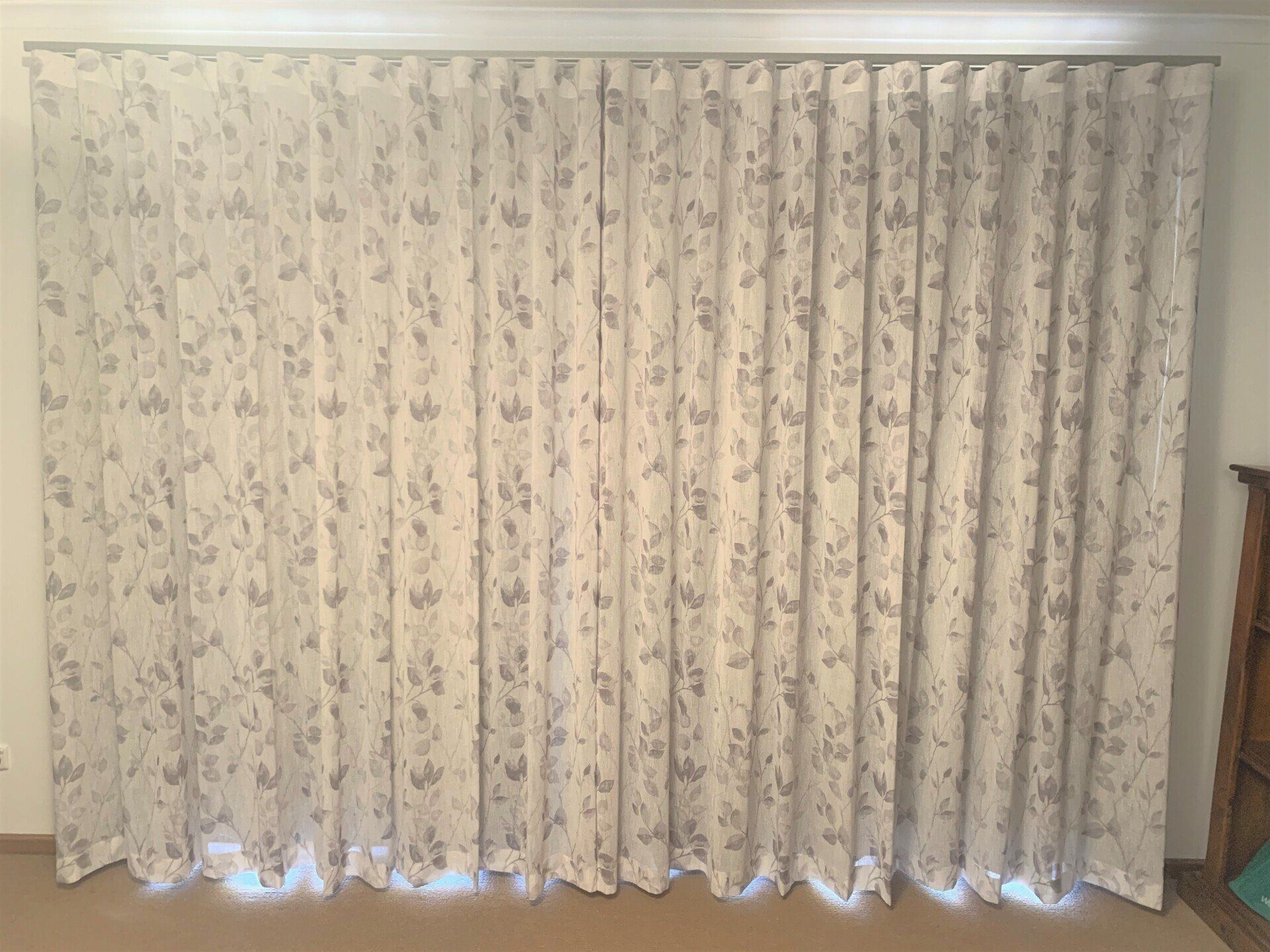 White Floral Patterned Curtains Covering a Wall — Alice Mobile Blinds in Ciccone, NT