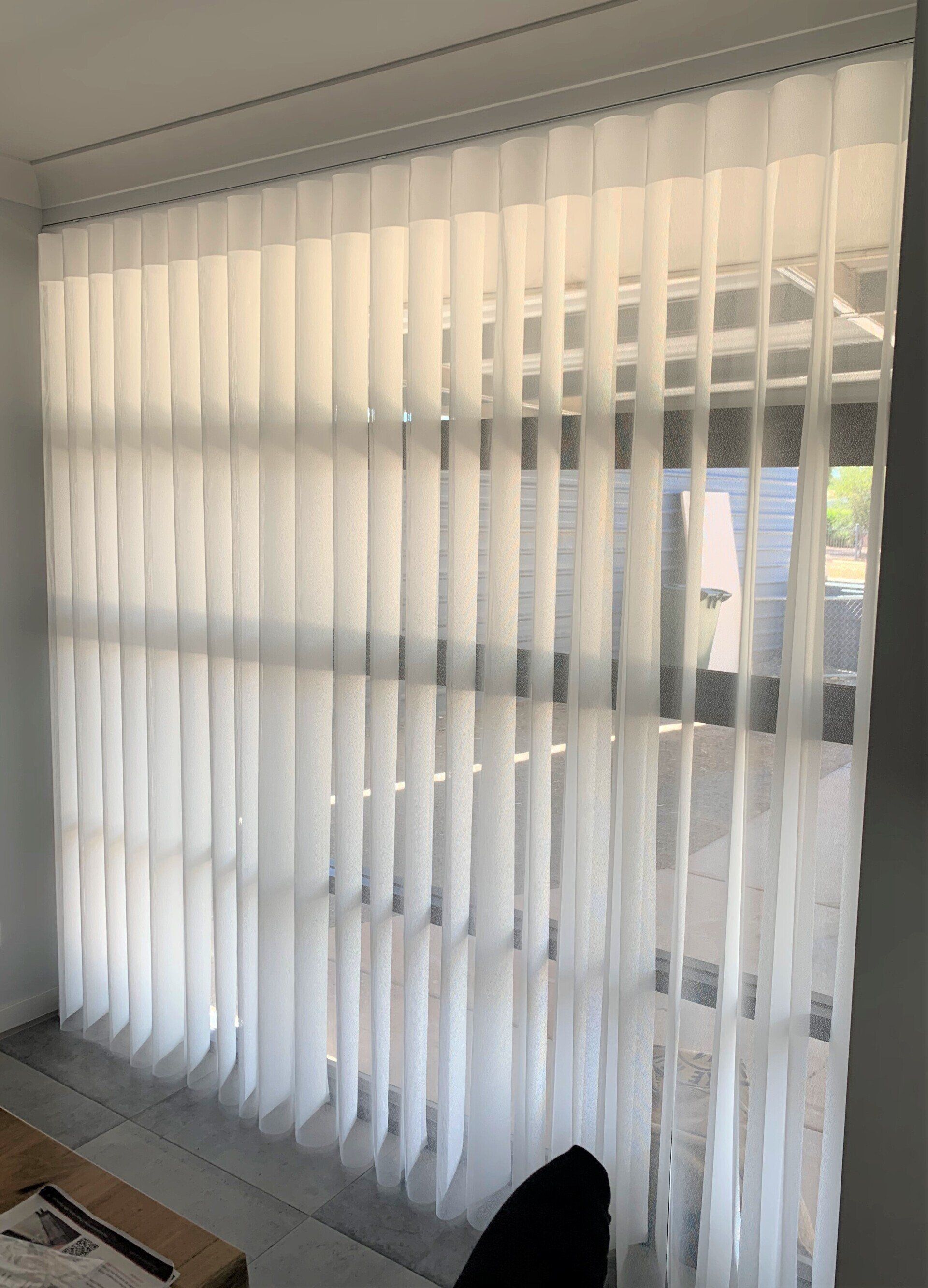 Vertical White Blinds Covering a Window — Alice Mobile Blinds in Ciccone, NT