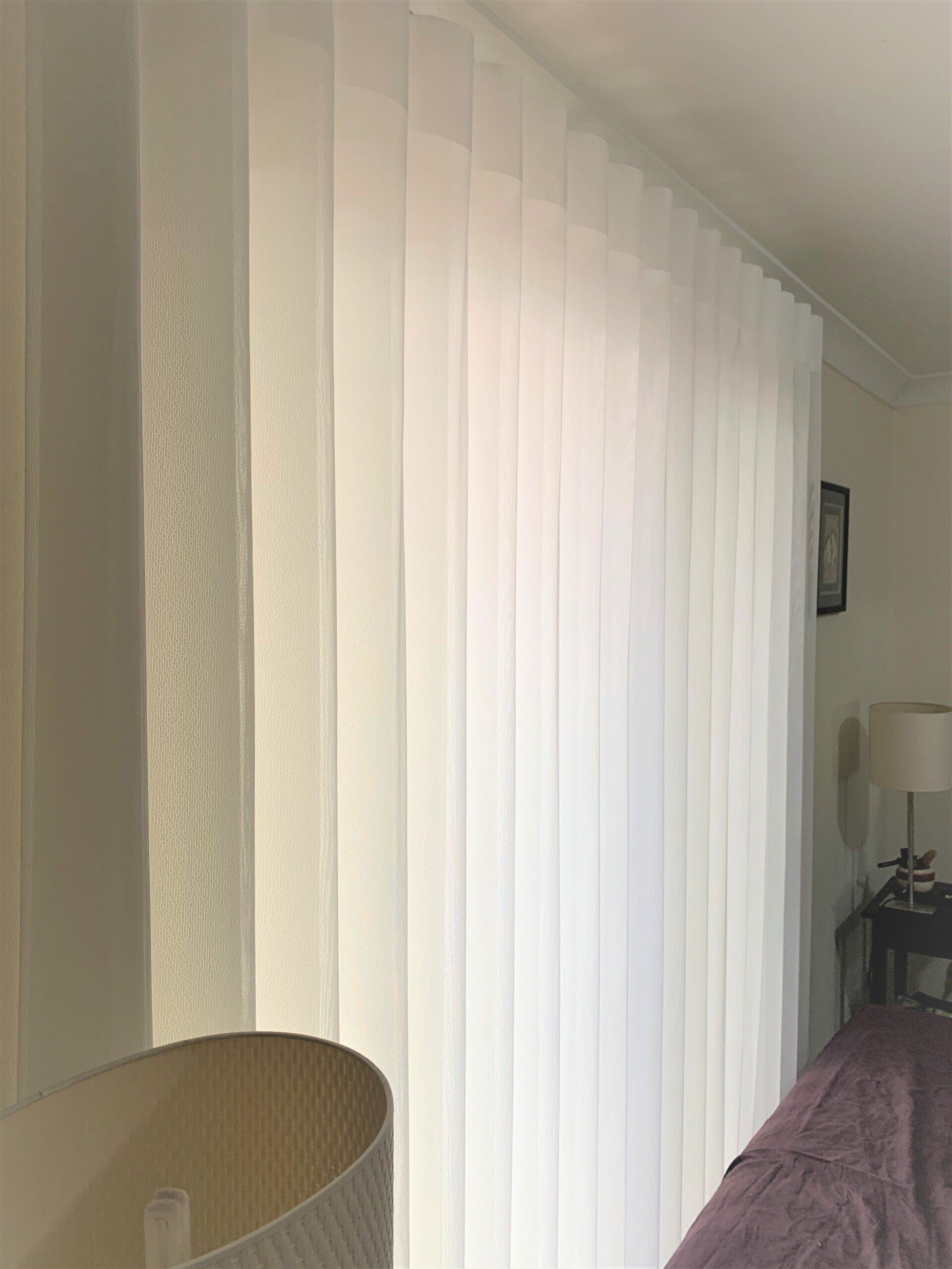 White Vertical Blinds on A Window — Alice Mobile Blinds in Ciccone, NT
