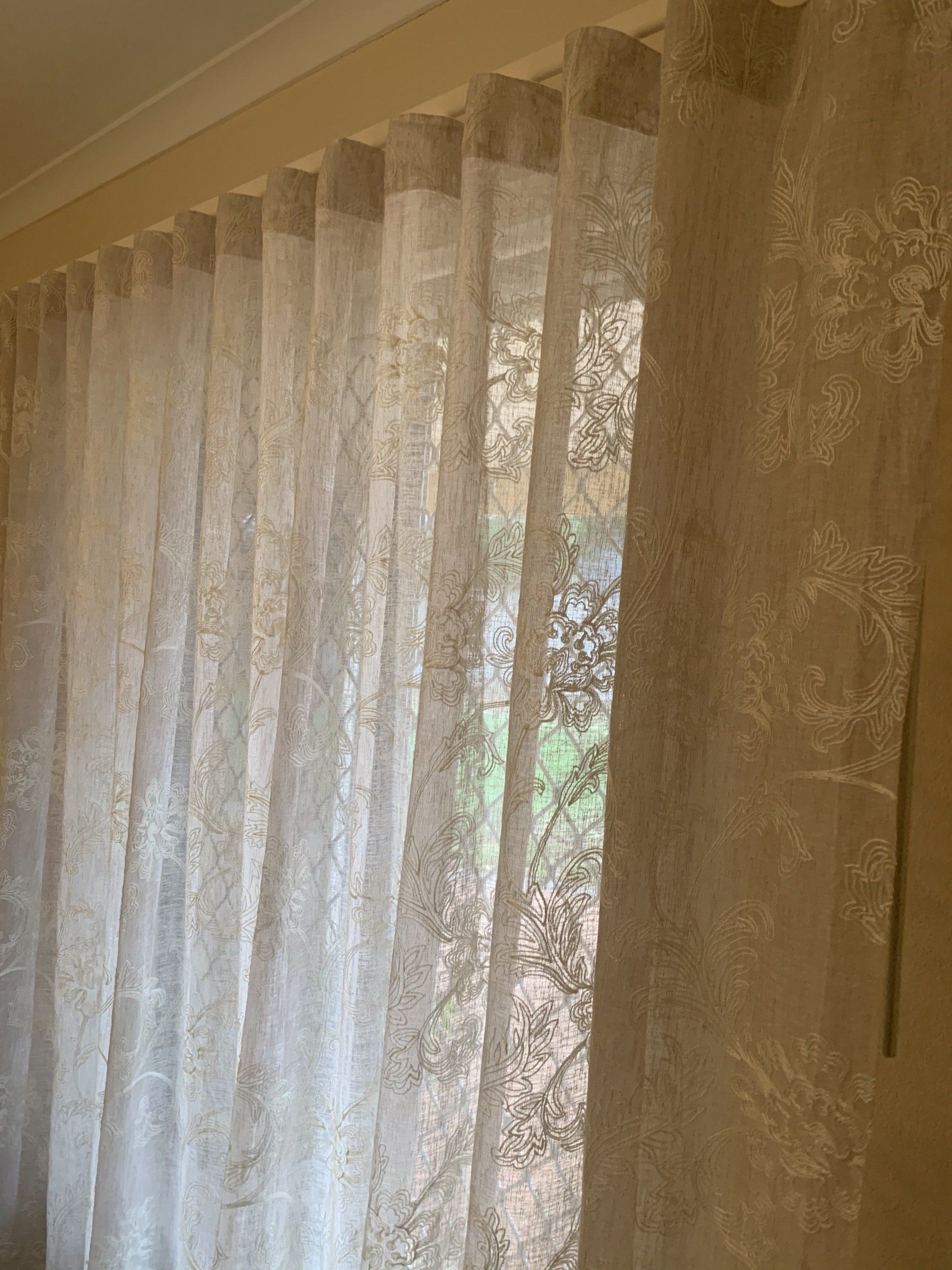 Sheer Light-Coloured Curtains Hanging in Front of A Window — Alice Mobile Blinds in Ciccone, NT